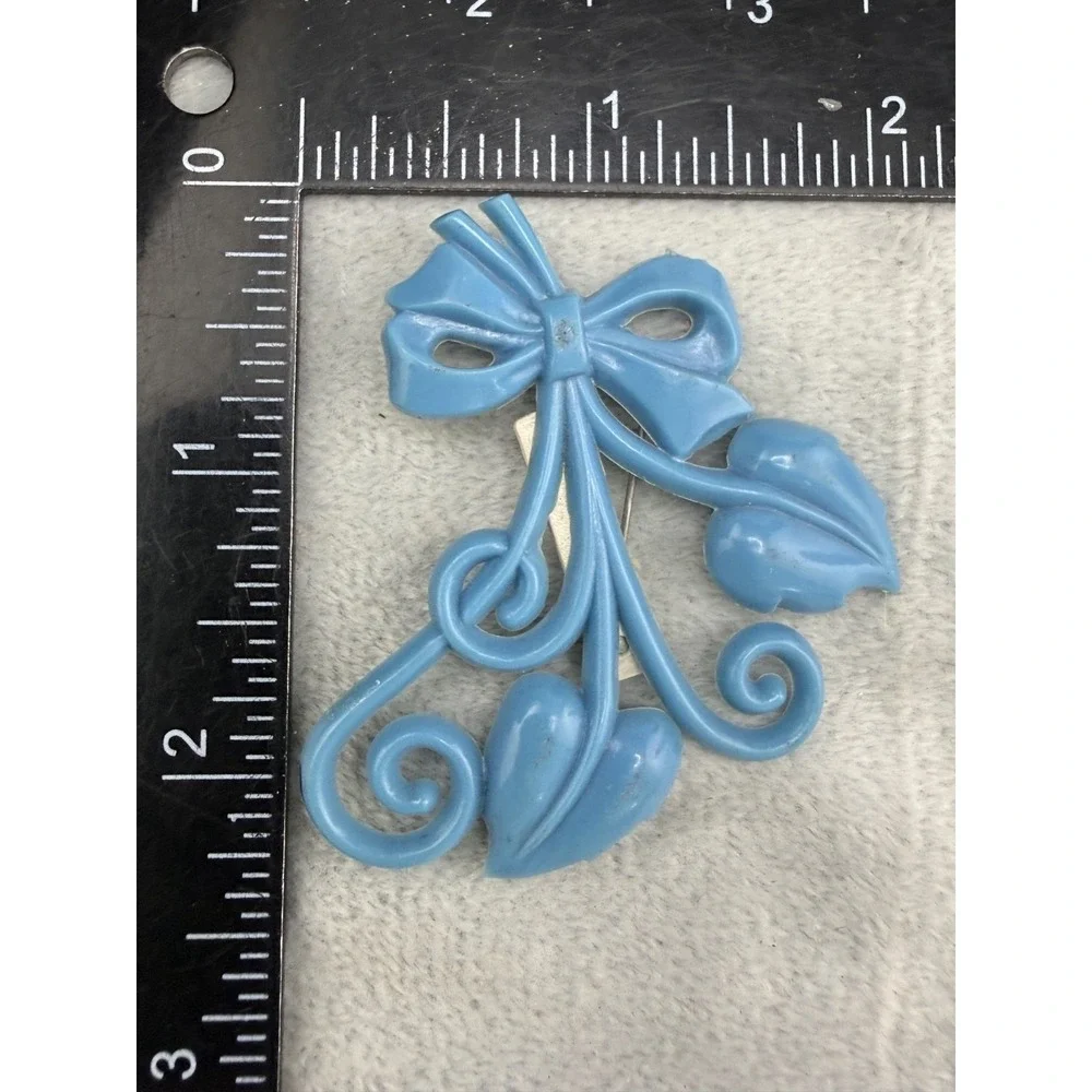 Vintage Brooch Light‎ Blue Molded Celluloid Bow